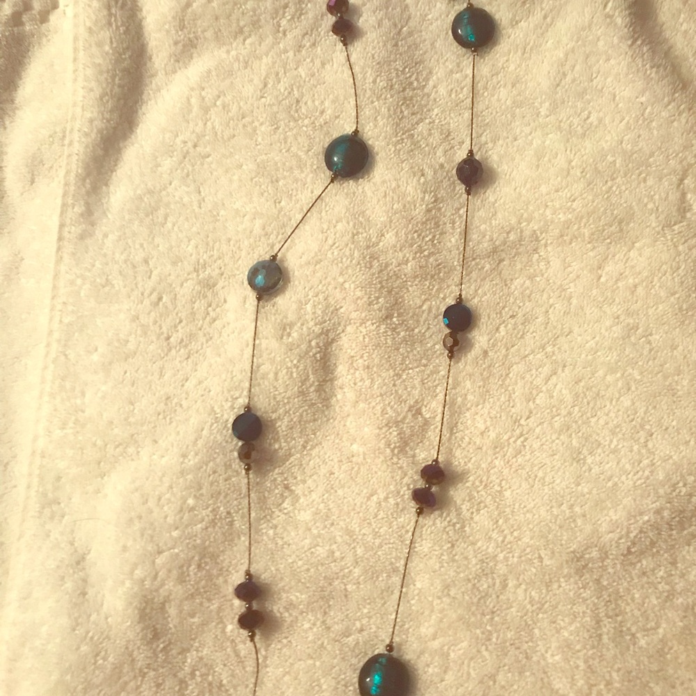 NWT. Long blue beaded necklace.  24 inches long